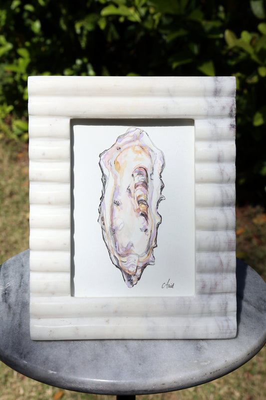 "Experience the beauty of Mixed Media Oyster 1. This unique piece of oyster original fine art is beautifully showcased on paper and framed in luxurious marble, providing a touch of sophistication to any interior. Elevate your home decor with this stunning mixed media masterpiece."