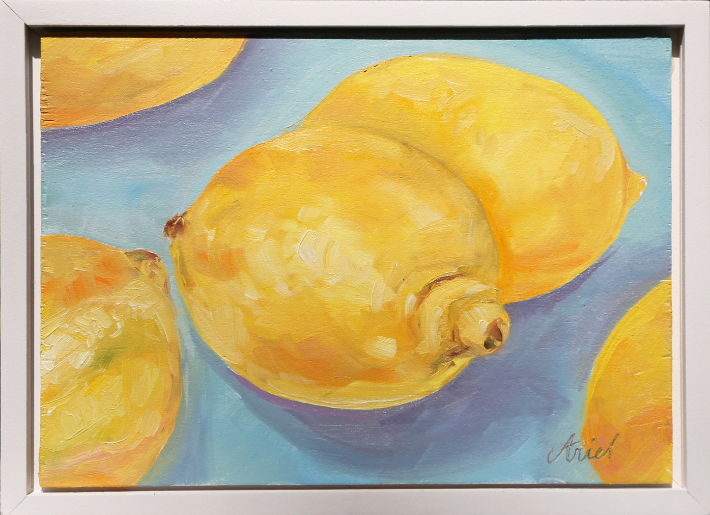 This Lemons #2 fine art oil painting captures the essence of a vibrant still life, perfect for adding a touch of elegance to any home decor. With a sleek white frame, this ready to hang piece is a must-have for any art lover. Bring a burst of color and sophistication into your space.